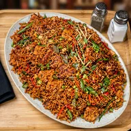 A platter of Szechuan fried rice with spring onion